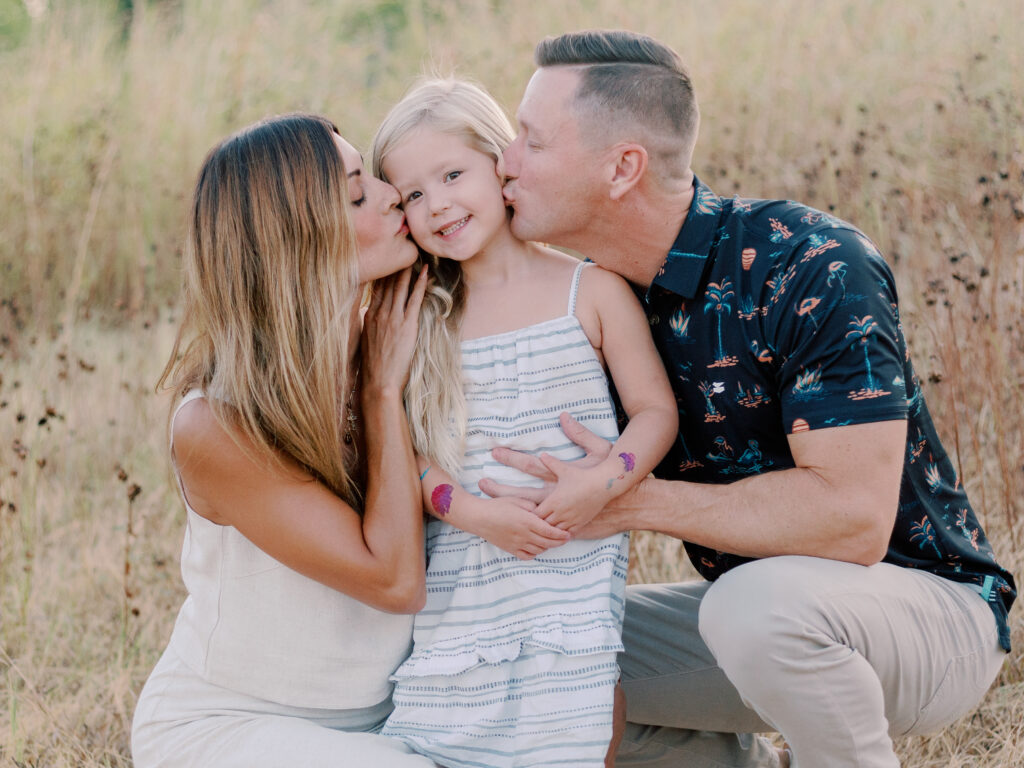 family kisses at white rock lake