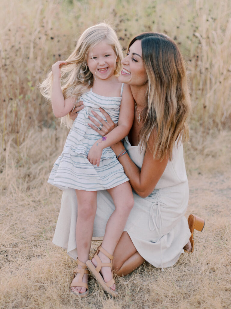 mom and daughter long grass