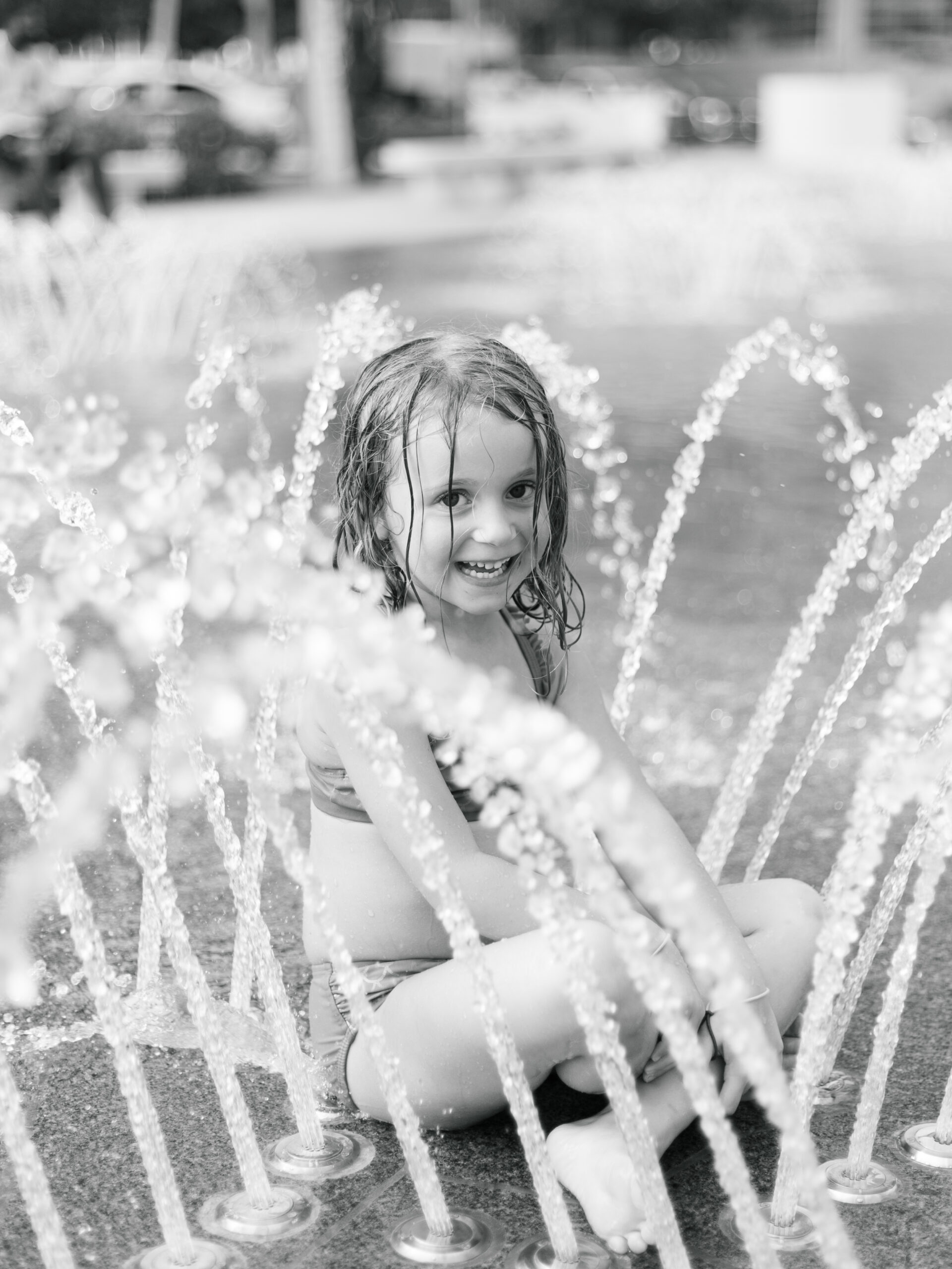 little girl playing in the fountain at Klyde Warren Park