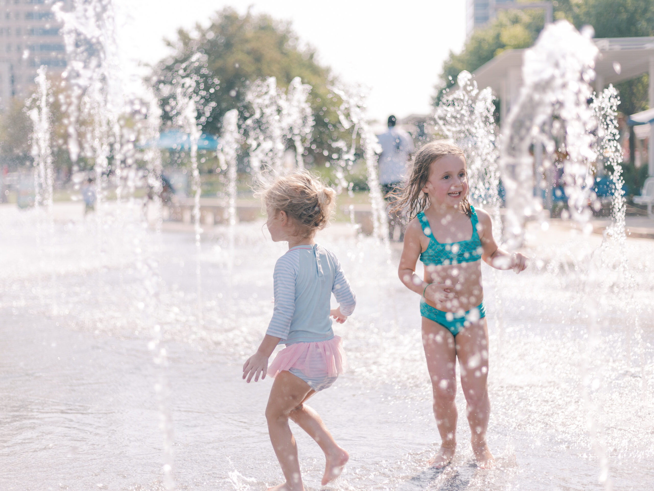 girls playing in the fountain at Klyde Warren Park
