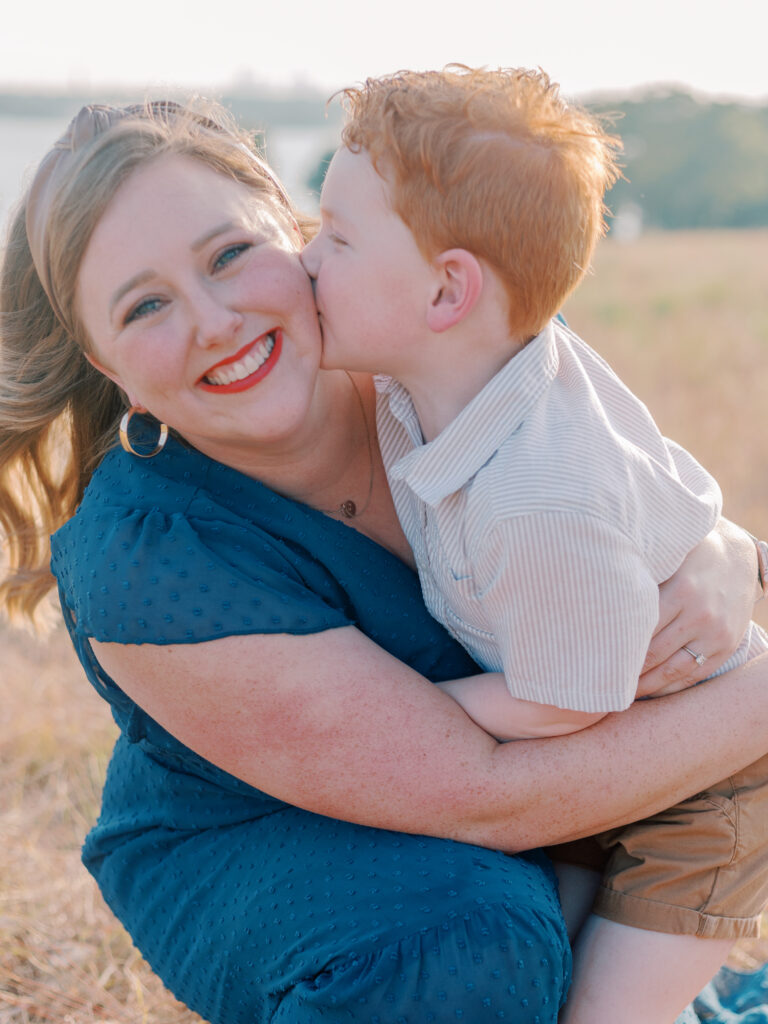 boy kisses moms cheek at Winfrey Point, Dallas