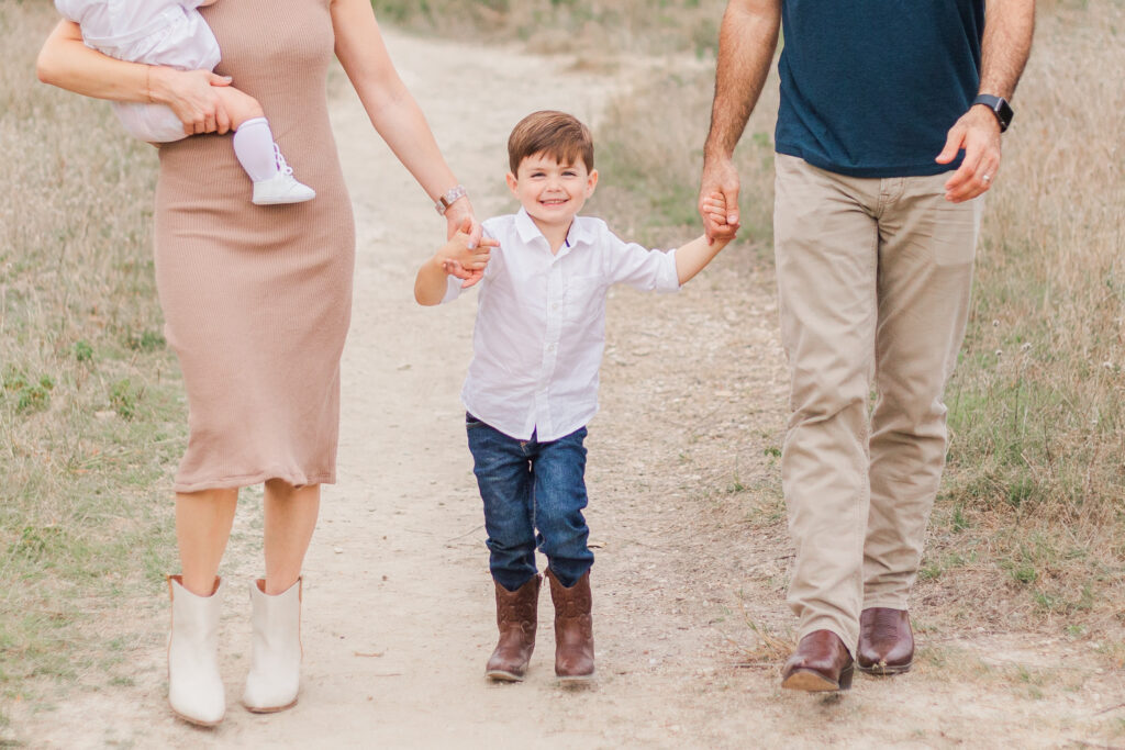 family holding hands at Norbuck Park, Kate White Photography