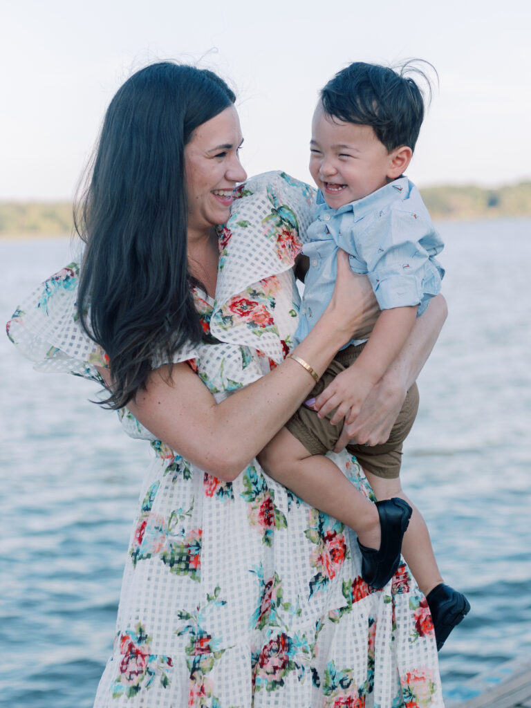 mom and baby laughing on the dock at White Rock Lake Dallas TX by Kate White Photography