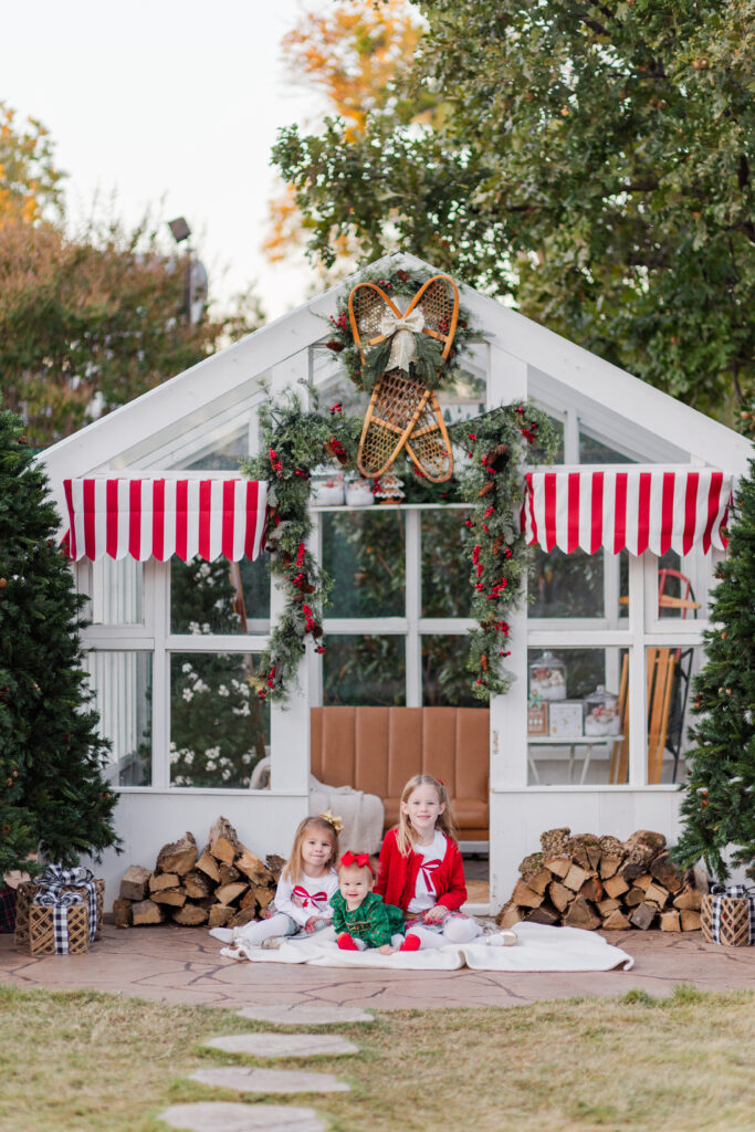 sisters in front of green house at Lemon Drop Studios in McKinney TX by Kate White Photography