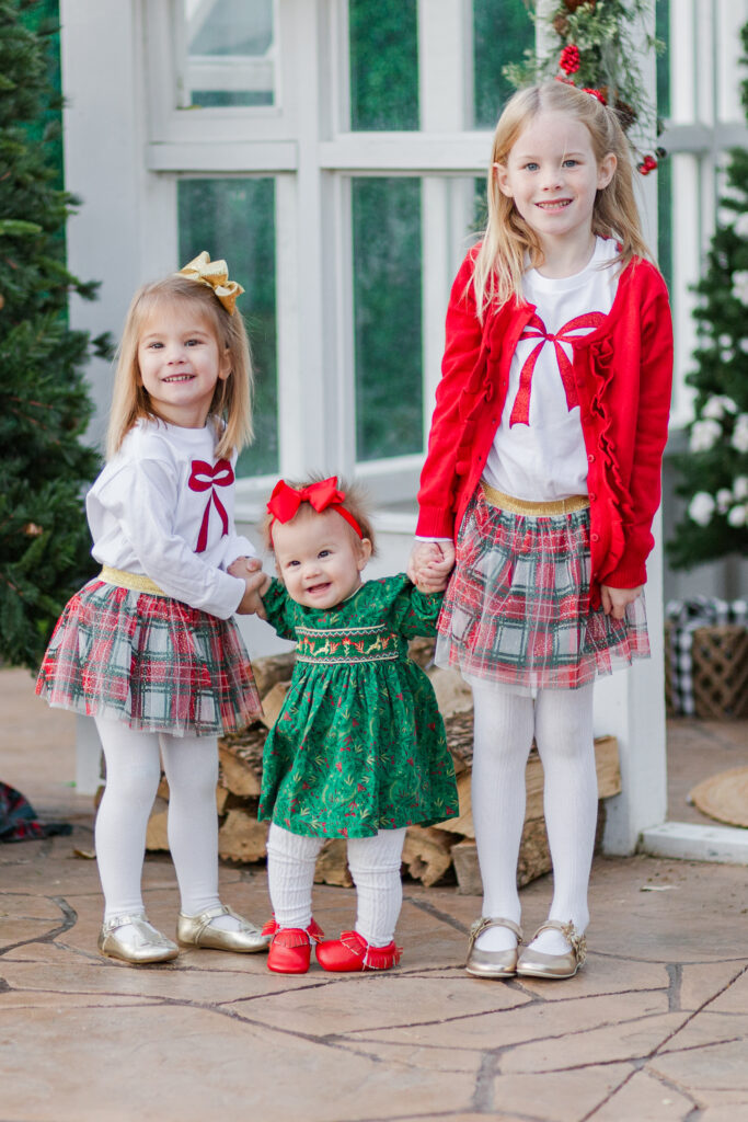 sisters standing at Lemon Drop Studios in McKinney TX by Kate White Photography