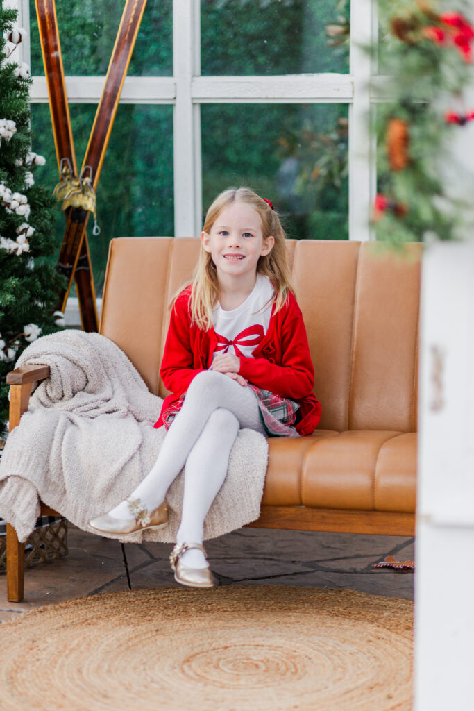girl sitting on couch at Lemon Drop Studios in McKinney TX by Kate White Photography