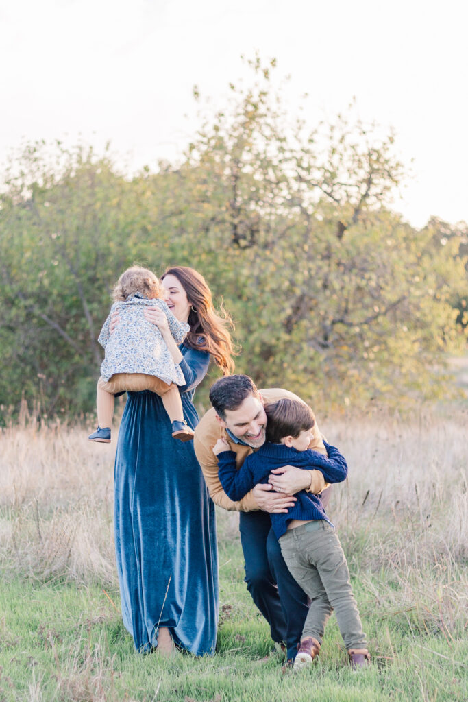 boy runs and hugs dad at Norbuck Park by Kate White Photography