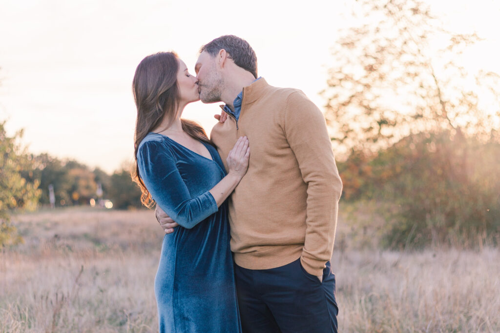 couple kisses at Norbuck Park by Kate White Photography