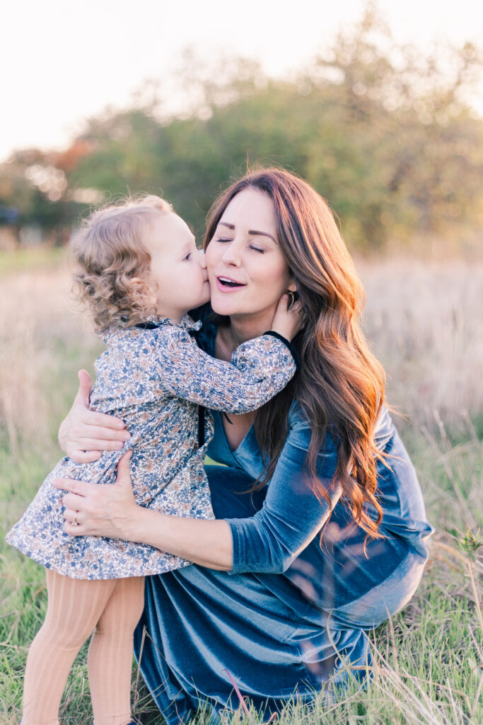 baby kisses mom at Norbuck Park by Kate White Photography