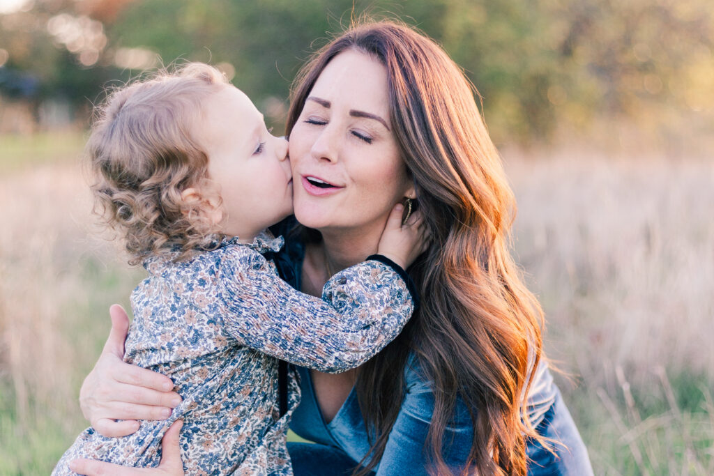 baby kisses mom at Norbuck Park by Kate White Photography