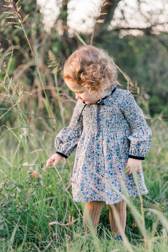 girl in grass at Norbuck Park by Kate White Photography
