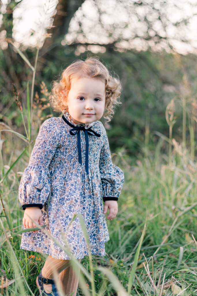 girl in grass at Norbuck Park by Kate White Photography