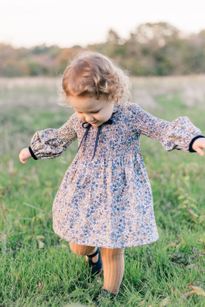 girl in grass at Norbuck Park by Kate White Photography