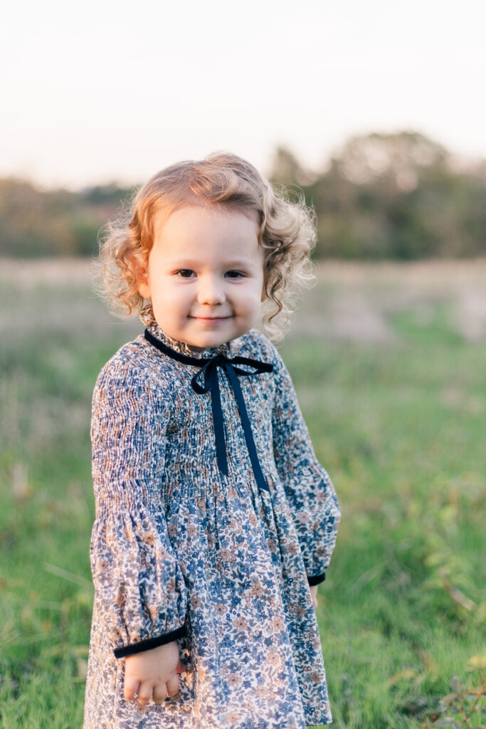 girl in grass at Norbuck Park by Kate White Photography