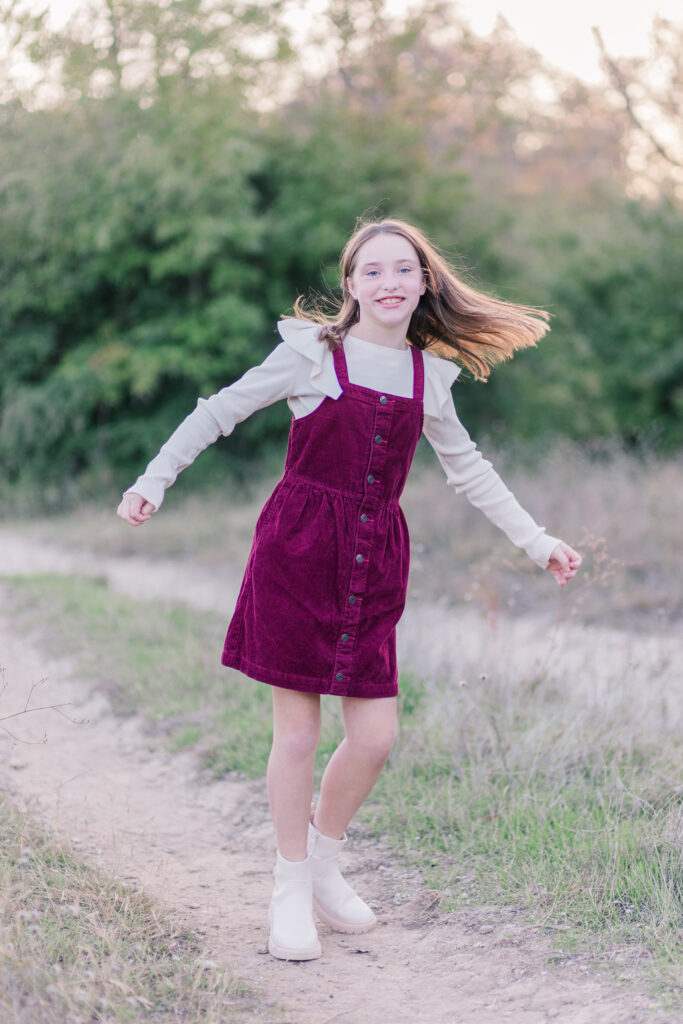 daughter smiles at Norbuck Park by Kate White photography