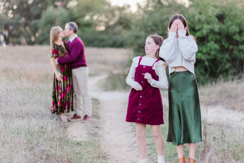 parents kiss at Norbuck Park by Kate White photography