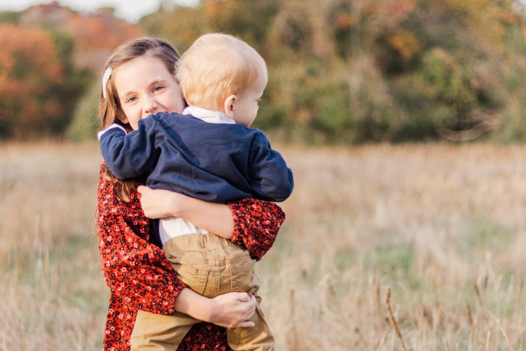 girl hold baby at Norbuck Park by Kate White Photography