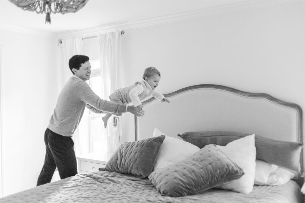 dad throws boy on bed