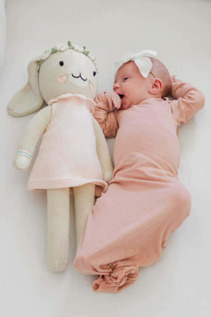 baby girl and stuffed bunny