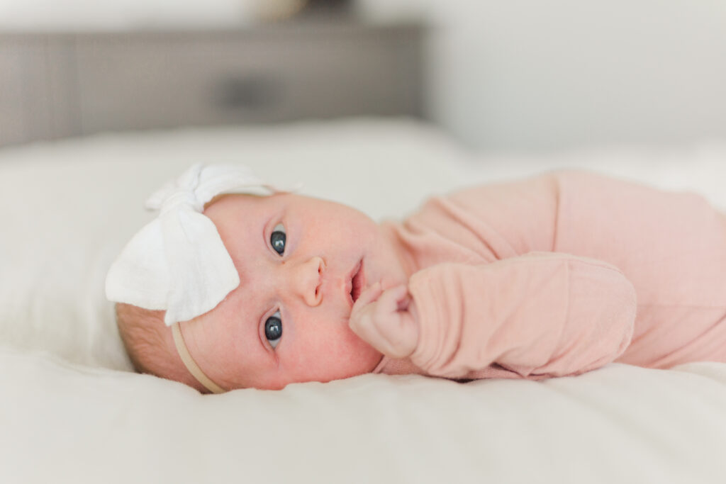 baby girl looks at camera