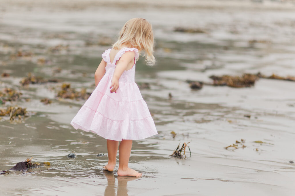 girl with toes in the sand
