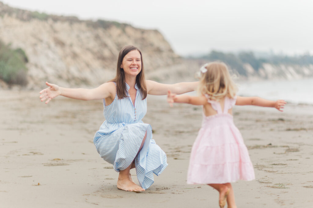 girl running to hug mom