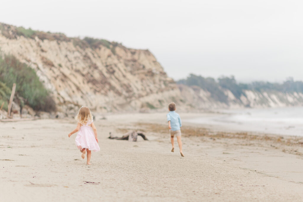 children running at the beach