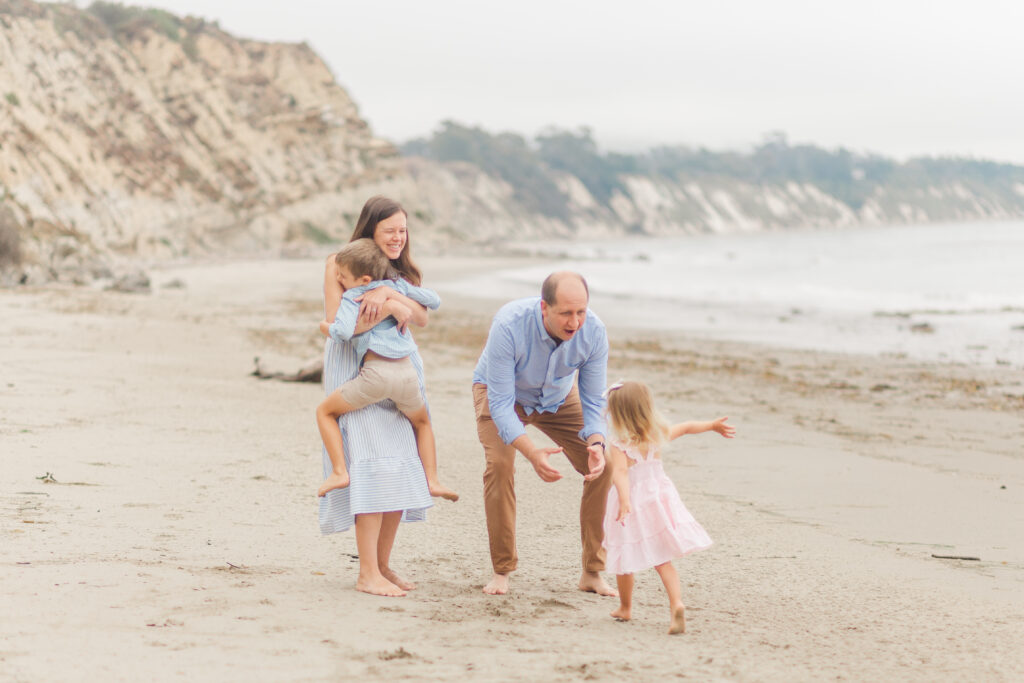 kids running to parents at the beach