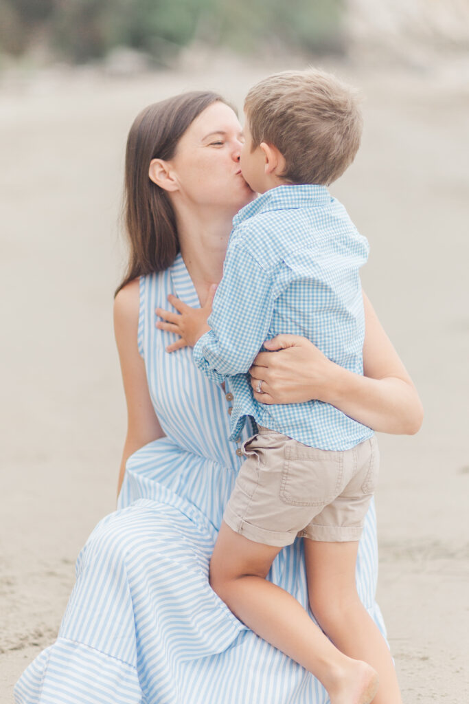 mom kissing son