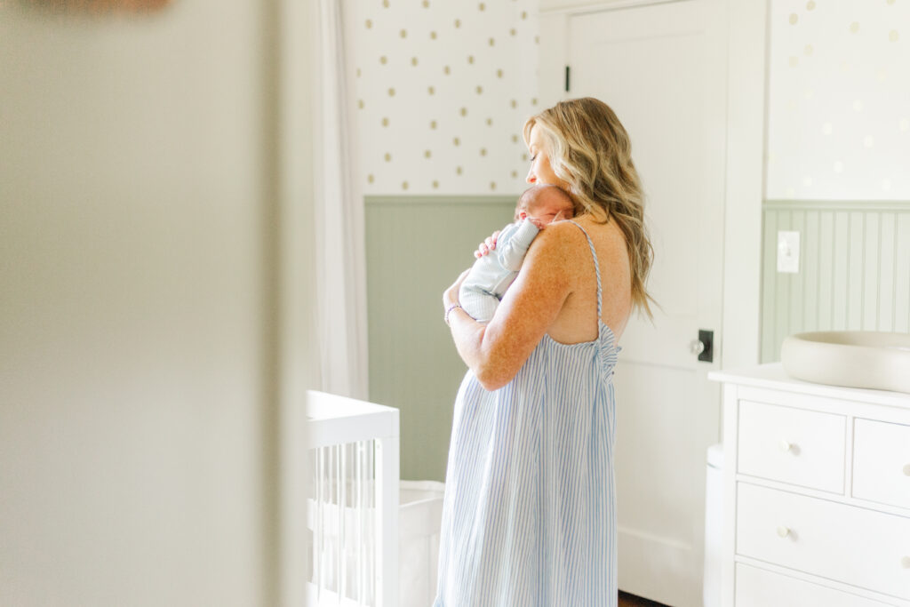mom comforting newborn