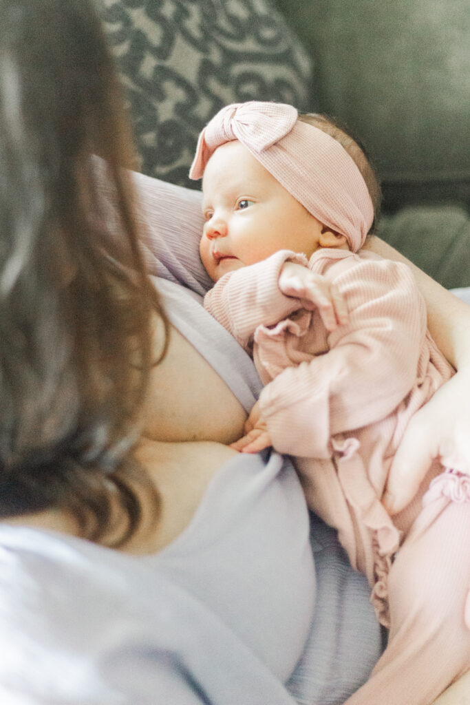 mom holding newborn in Dallas TX