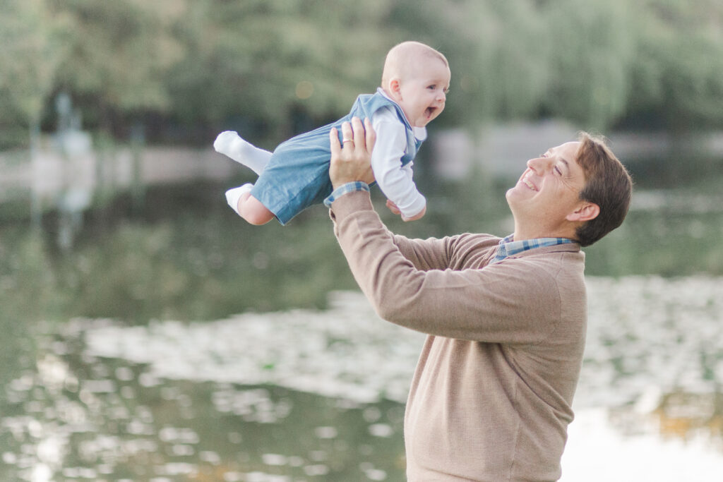 dad makes baby boy fly in the air