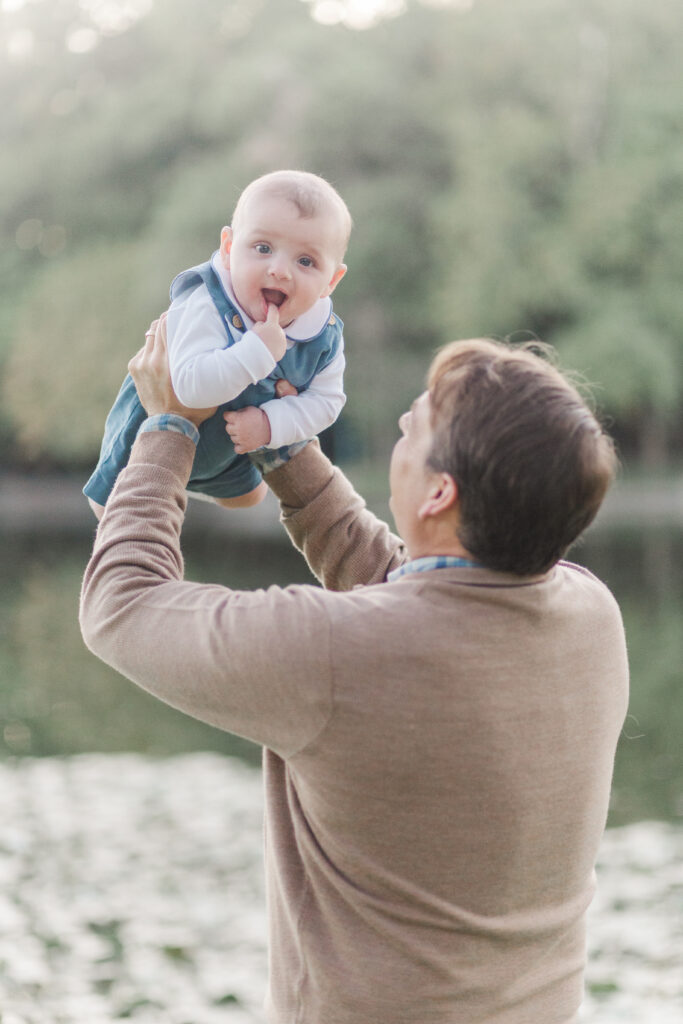 dad lifts baby boy
