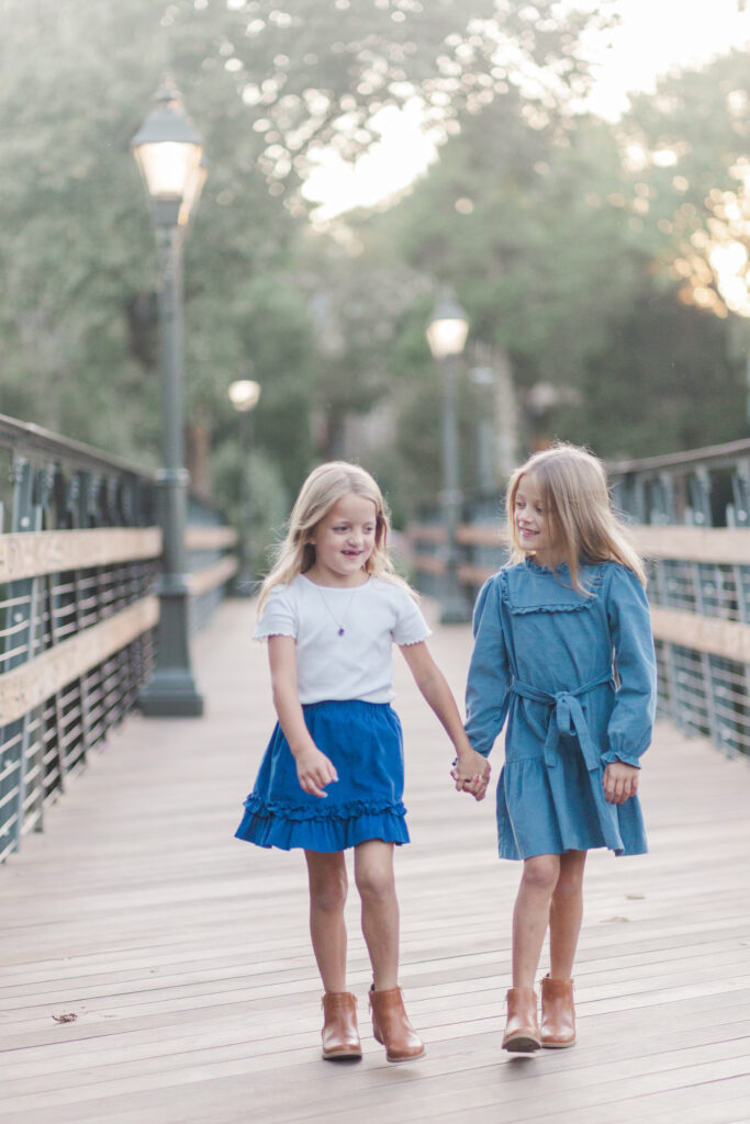 twins walk on bridge