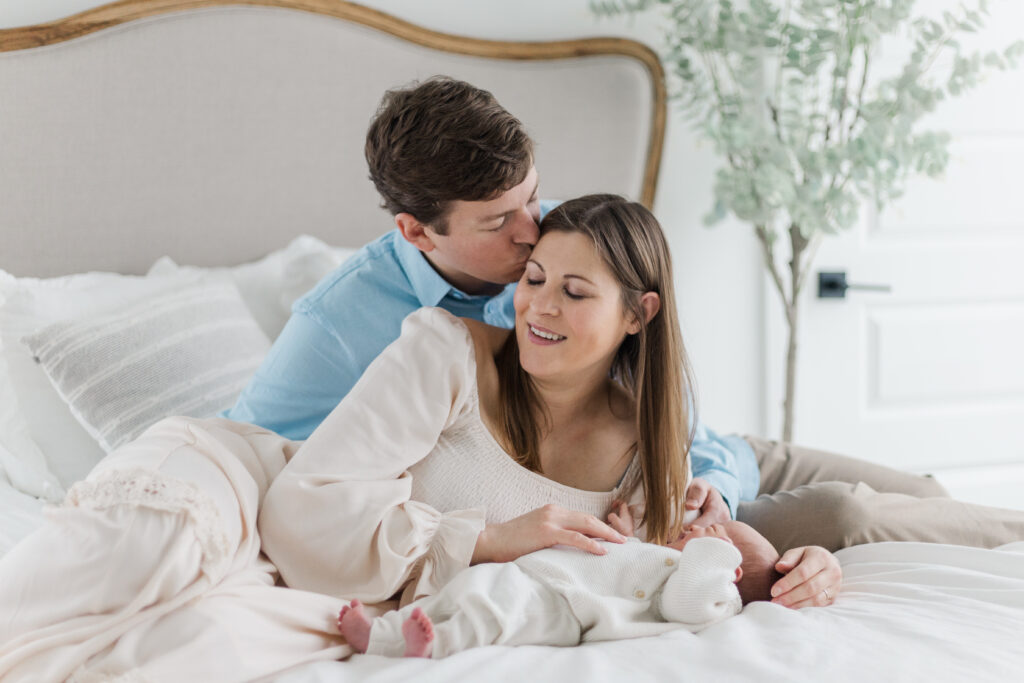 couple with newborn at Lemon Drop Studios in McKinney TX