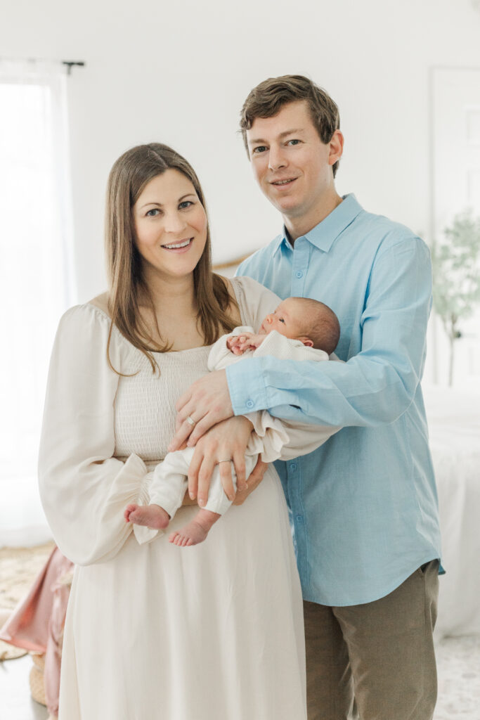 couple with newborn at Lemon Drop Studios in McKinney TX