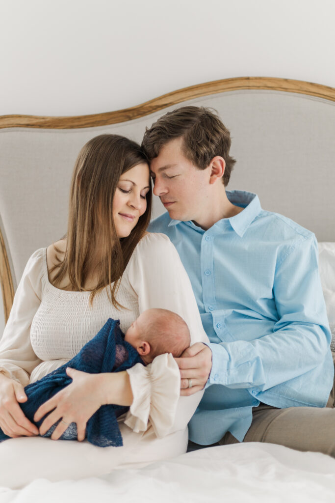 mom, dad, and newborn at Lemon Drop Studios in McKinney TX