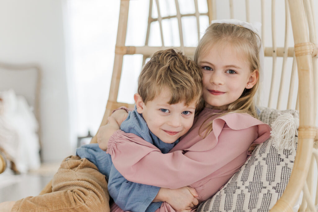 brother snd sister hugging at Lemon Drop Studios in McKinney TX
