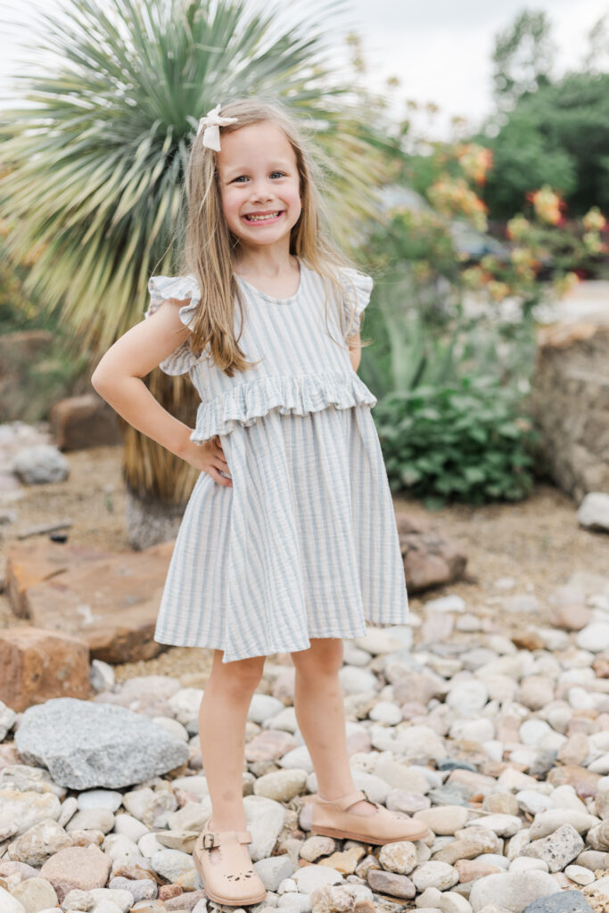 little girl at Grapevine botanical garden