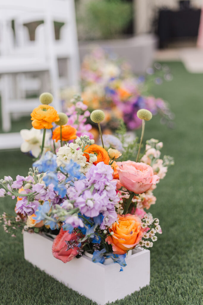 gorgeous rainbow colored flower arrangement at CA wedding