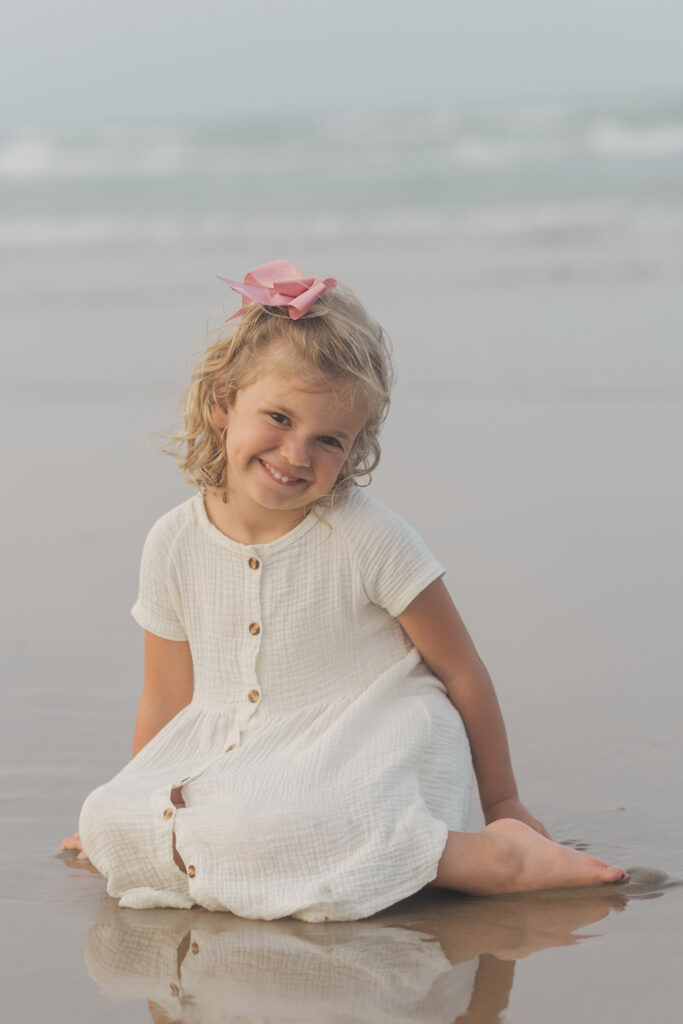girl sitting in the sand