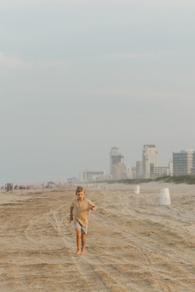 boy running at the beach