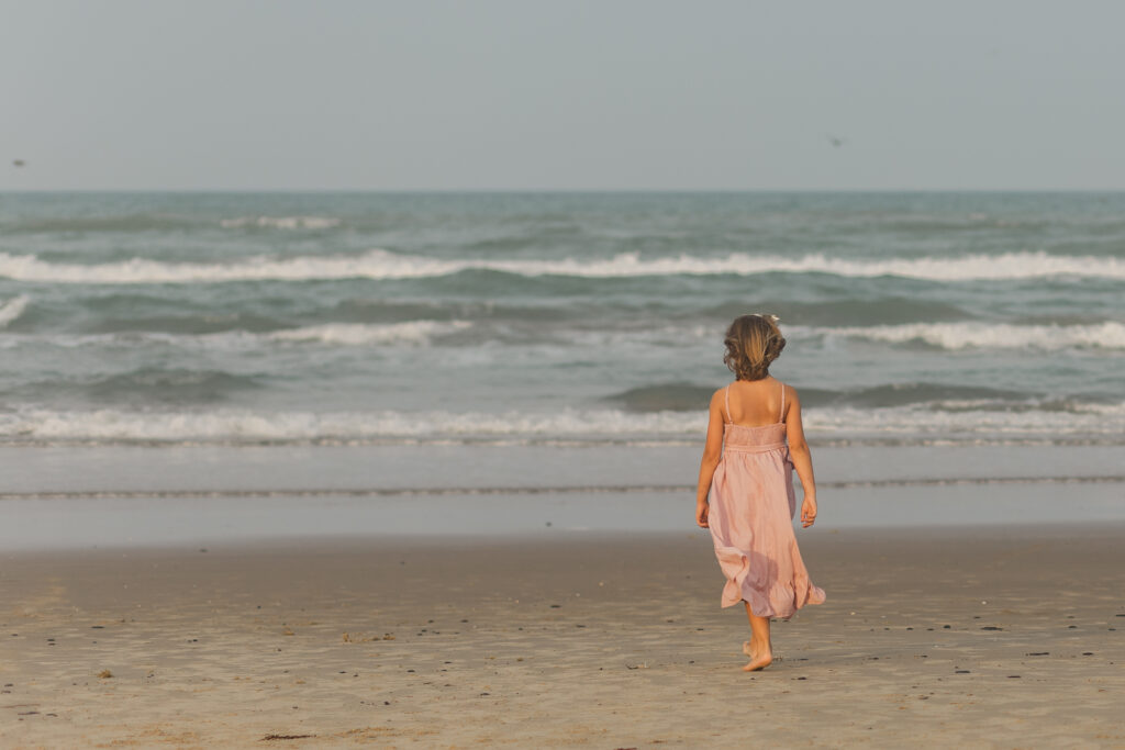 girl walking at the beach