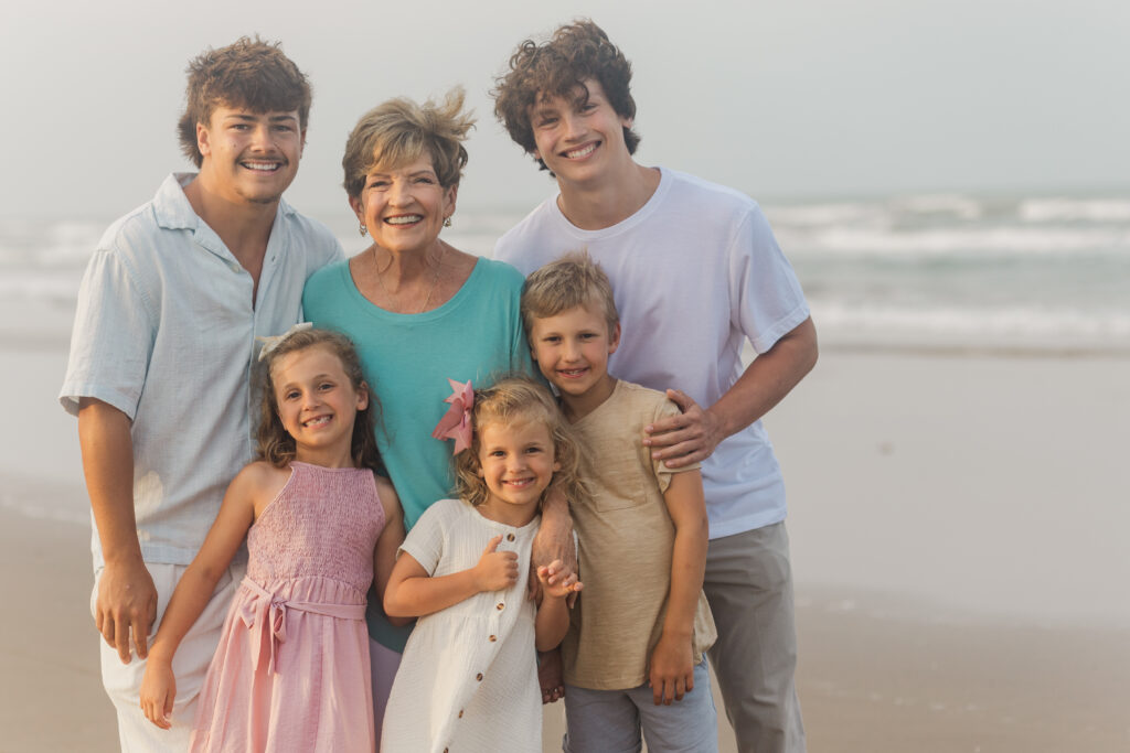 grandma and grandkids at the beach